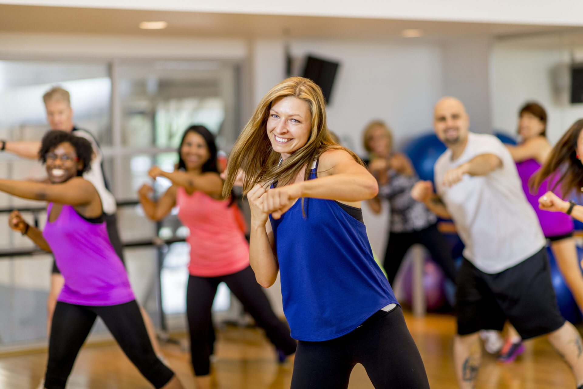 A group of people doing different exercises together.