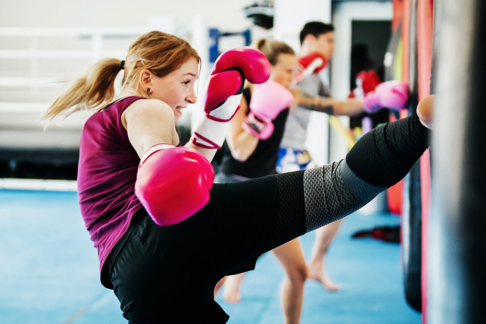 A group of people in pink boxing gloves.